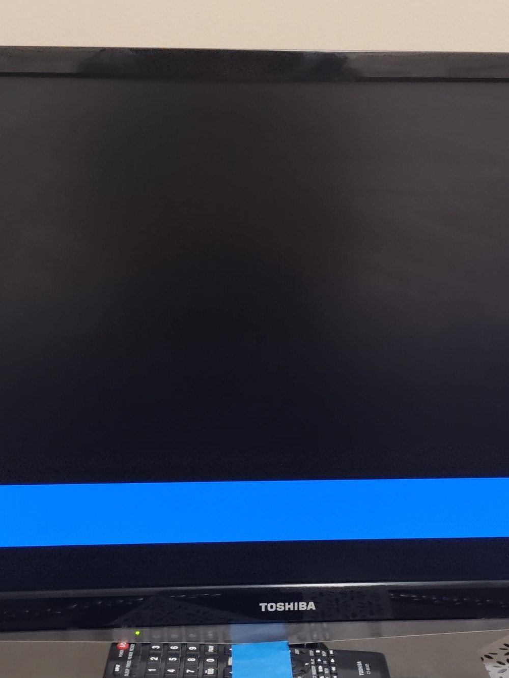 Toshiba Flat Screen TV in Black with Blue Display Accent